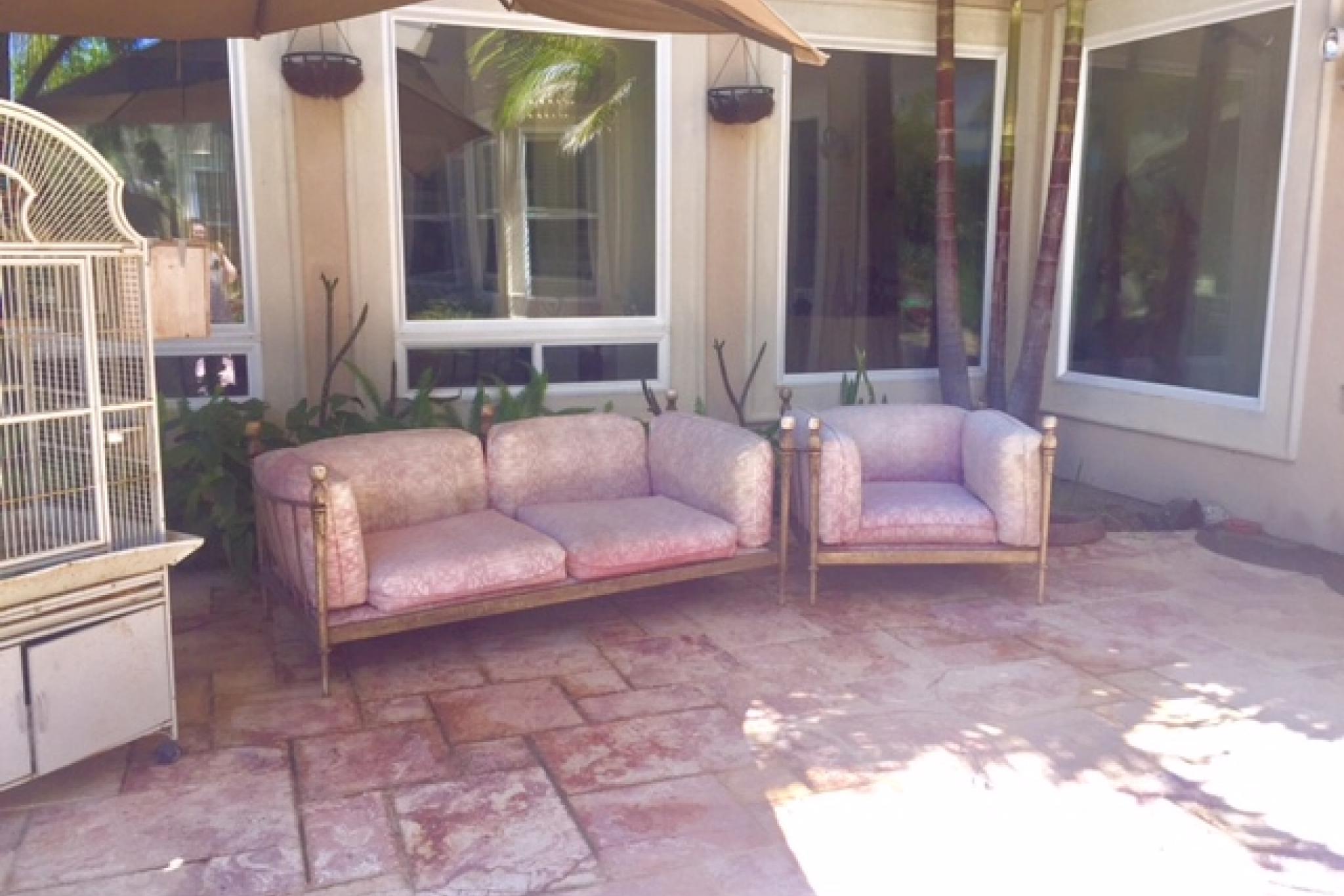Garden Abode - Comfortable outdoor seating next to finch cage